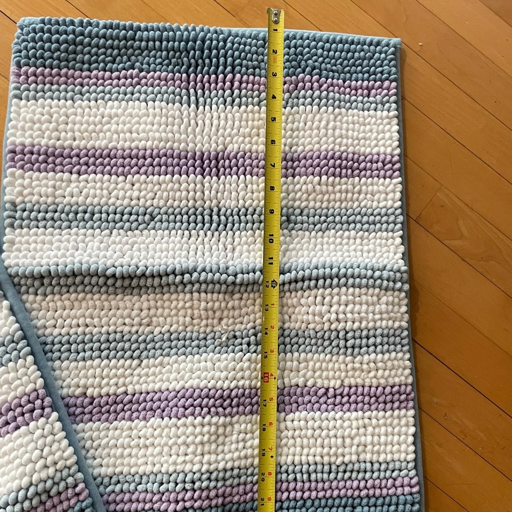 Two - rugs that are purple, white and blue